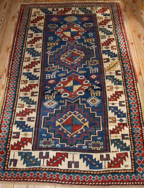 antique caucasian kazak rug bold design with animals late 19th century