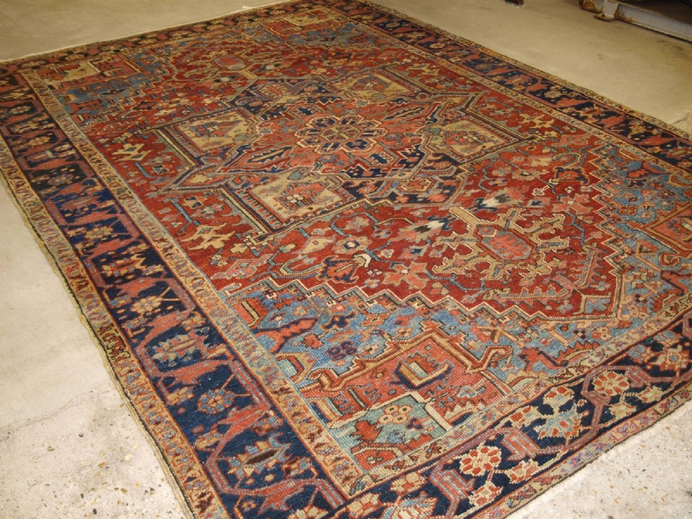 antique heriz carpet with traditional medallion design soft colours circa 1900