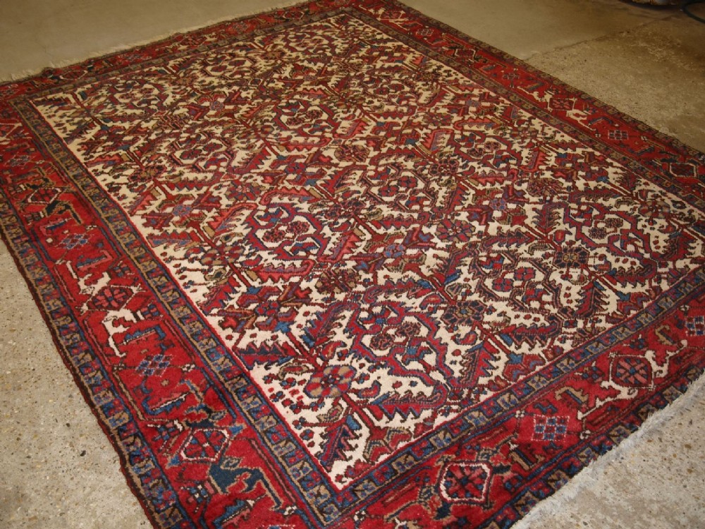 old heriz carpet with all over design red ivory with light blue abt 50 yrs old