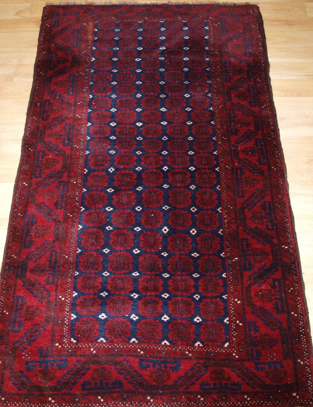 old afghan rug of traditional design with superb colour circa 1920