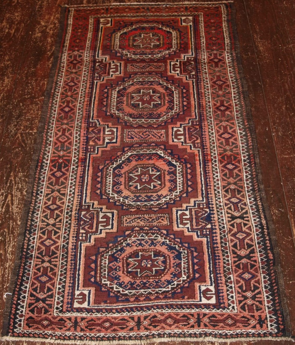 antique baluch rug with star gul design afghanistan circa 1900