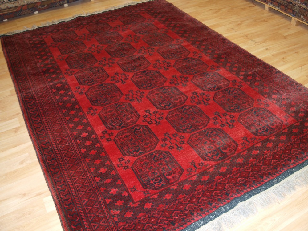old afghan village rug with traditional ersari gul design about 70 years old