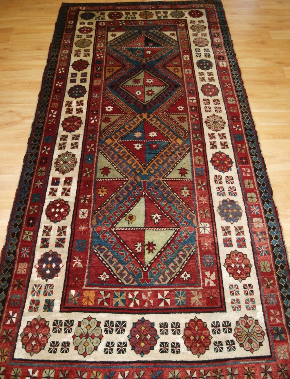 old caucasian talish long rug with four medallions circa 1920