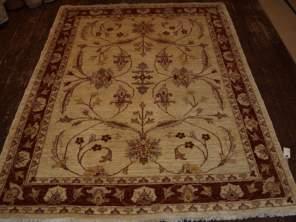 afghan rug of 'ziegler' design ivory ground with large scale floral design