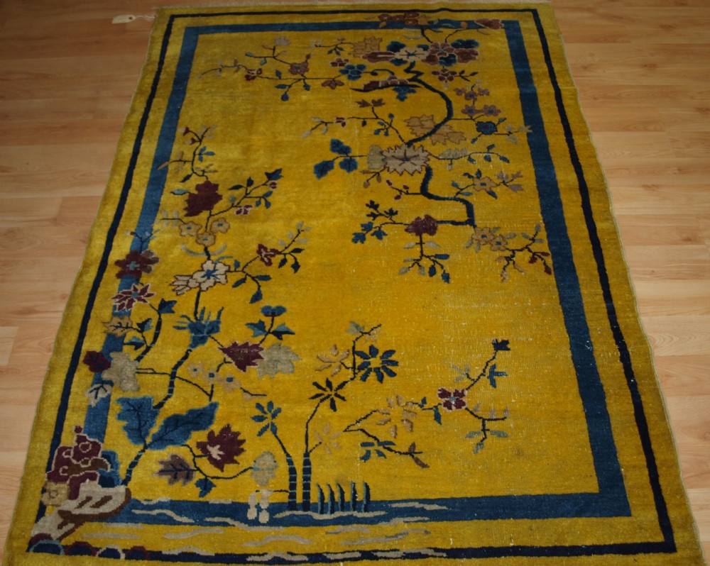 antique yellow ground chinese peking rug traditional design circa 1900