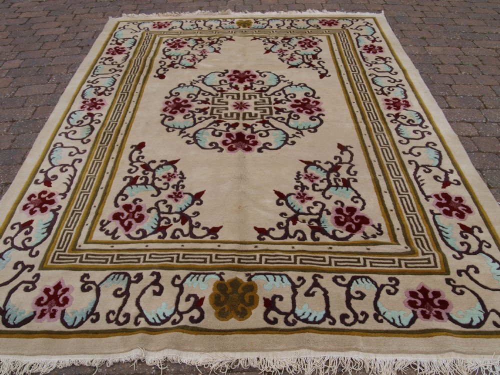 old nepalese carpet traditional design light colours about 40 years old