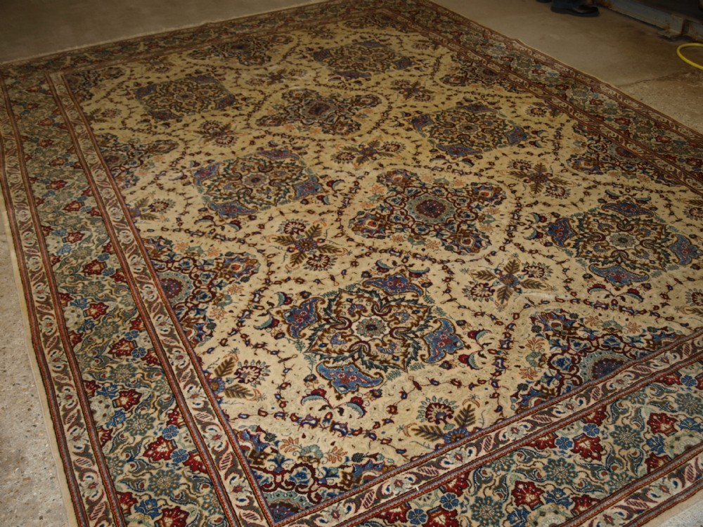 old persian qum carpet ivory ground with traditional design about 60 years old