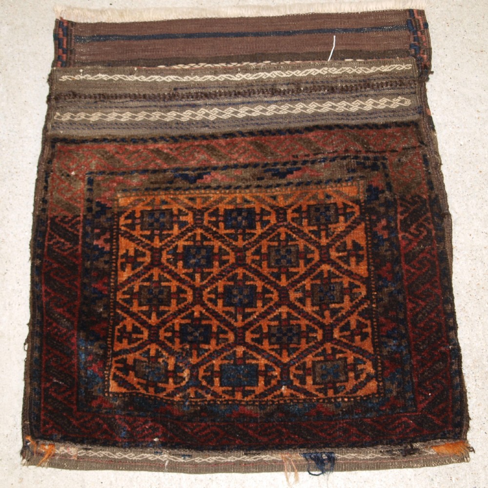 antique baluch saddle bag with plain weave back lattice design circa 1900
