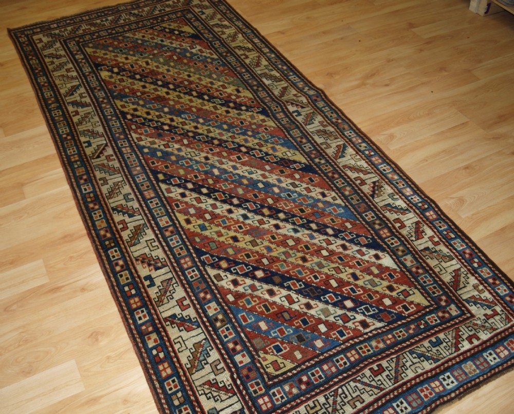 antique caucasian gendje kazak long rug with stripe design superb colours 2nd half 19th century