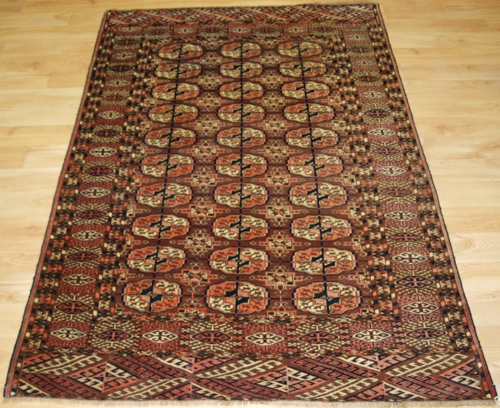 antique tekke turkmen rug fine weave soft wool browns and pinks small size circa 1900