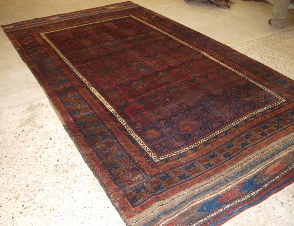 antique western afghan baluch carpet shrub design long kilim ends circa 1870