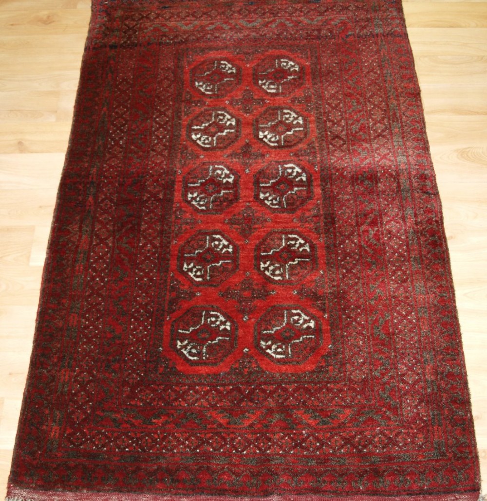 old afghan village rug with traditional design of small size circa 1960