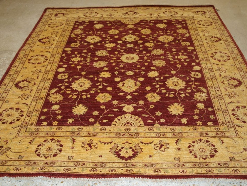 afghan ziegler design rug burgundy field with ivory gold border about 10 years old