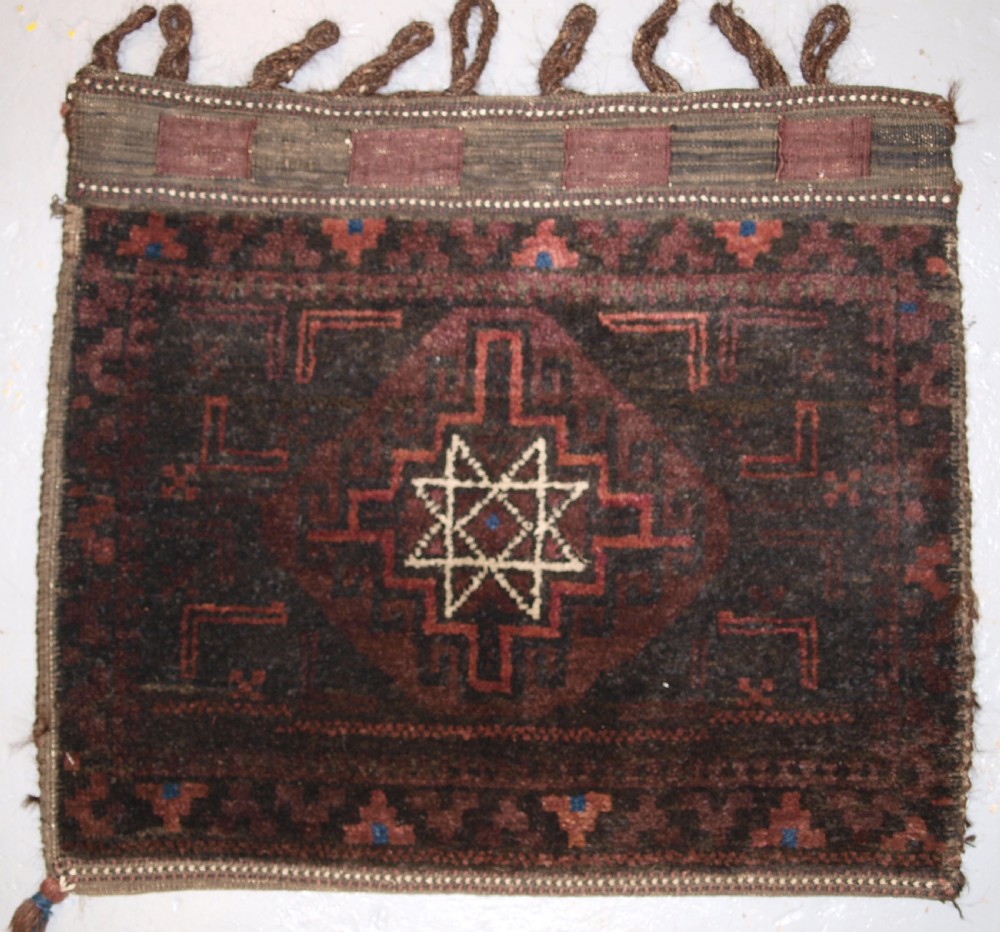 old afghan baluch saddle bag with star design and plain weave back circa 1920