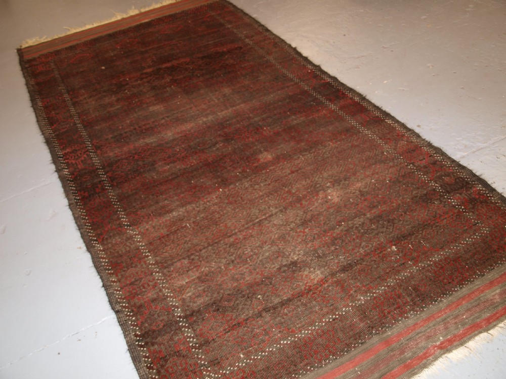 antique afghan baluch rug heavy wear good lived with look circa 1900