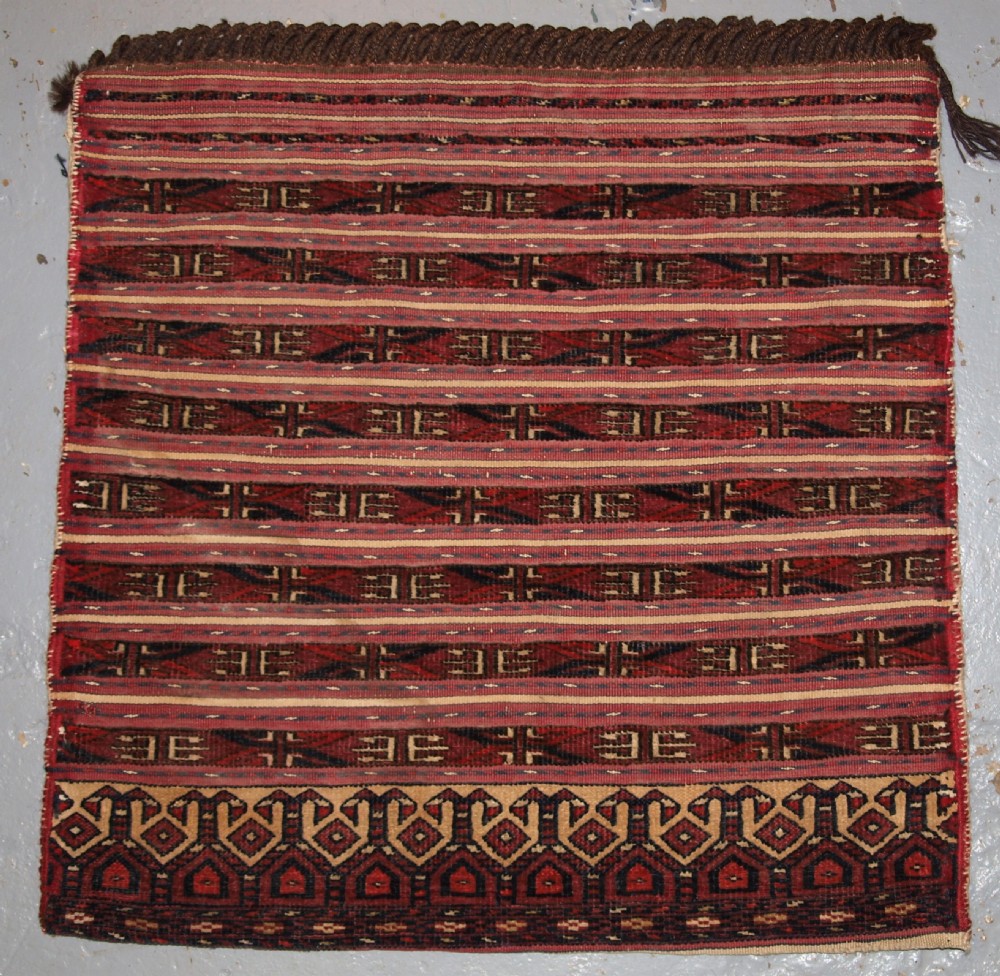 antique tekke turkmen saddle bag in banded mixed technique plain weave back circa 190020