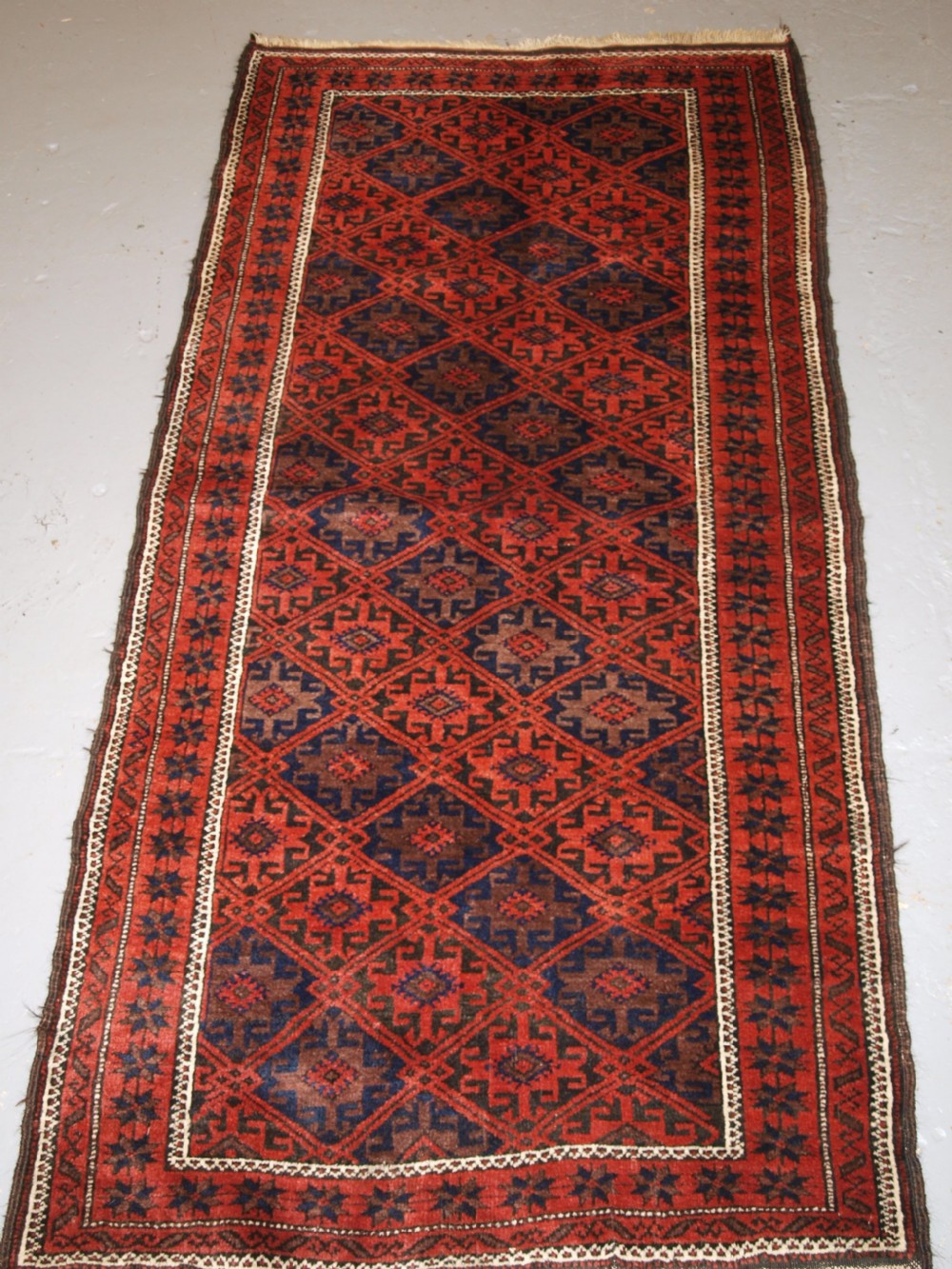 antique baluch rug with lattice design star border circa 1900