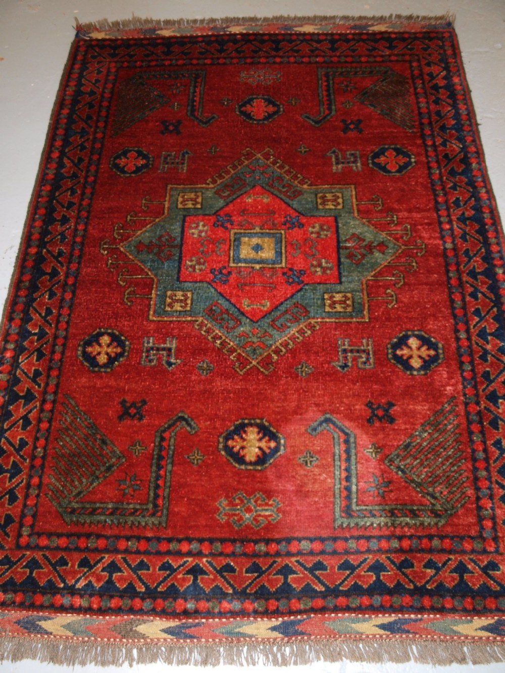 old afghan rug with caucasian kazak design about 30 years old