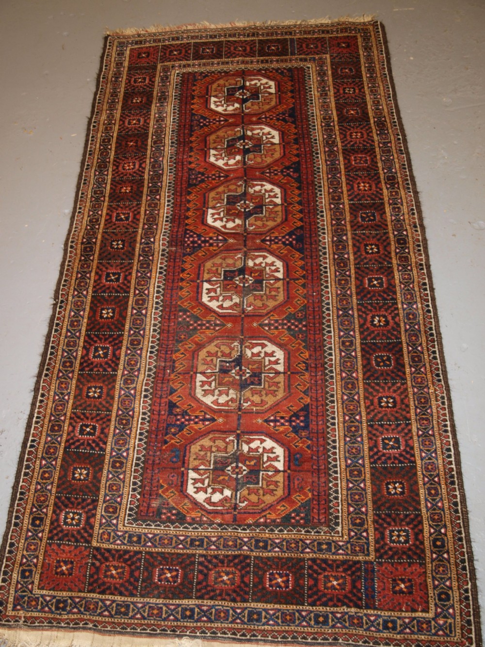 antique baluch rug by the mahdad khani tribe large tekke guls circa 1900