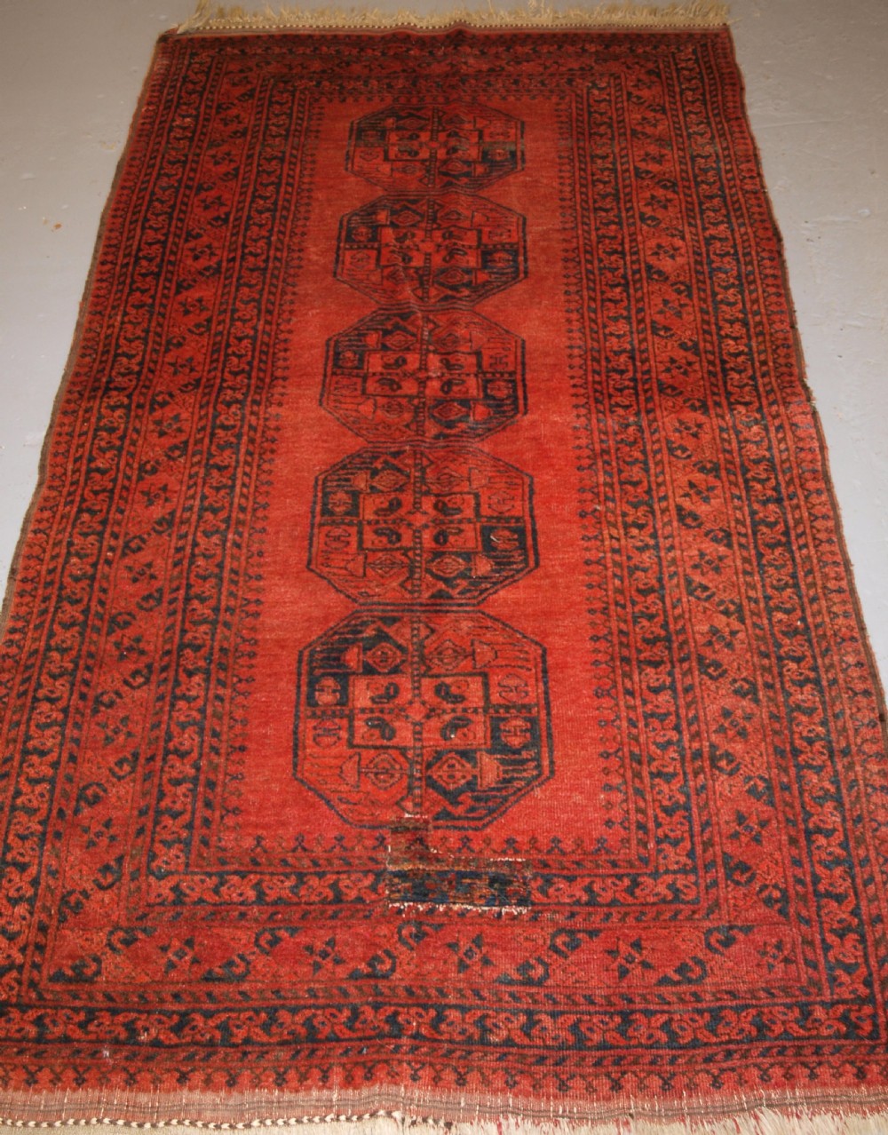 old north afghan village rug with superb colour low price due to old repair circa 1920