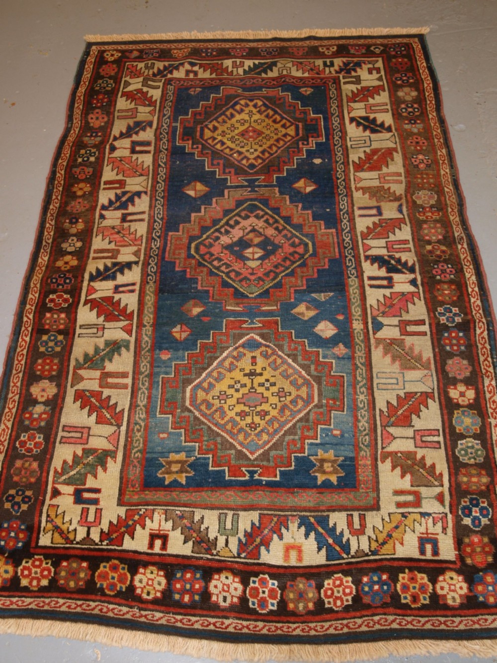 antique caucasian kazak three medallion rug with superb soft colours circa 1900