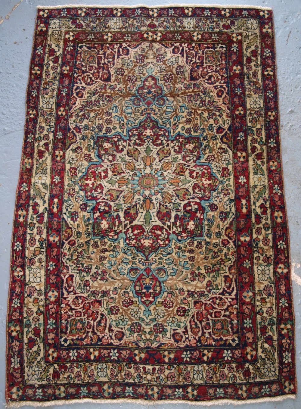 antique persian kirman rug of small size fine weave and pleasing colour circa 1900