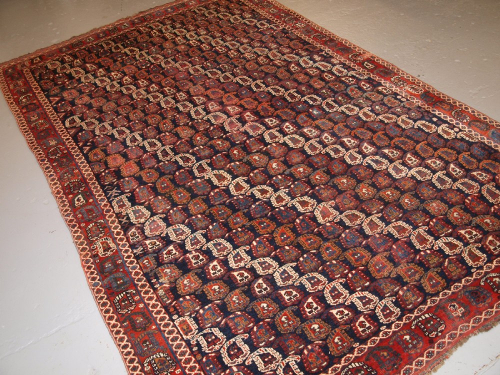 antique persian rug by the khamseh tribe with all over boteh design late 19th century