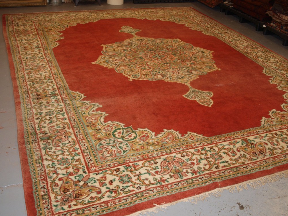old turkish isparta carpet classic medallion design light red ground with pastel colours circa 1920