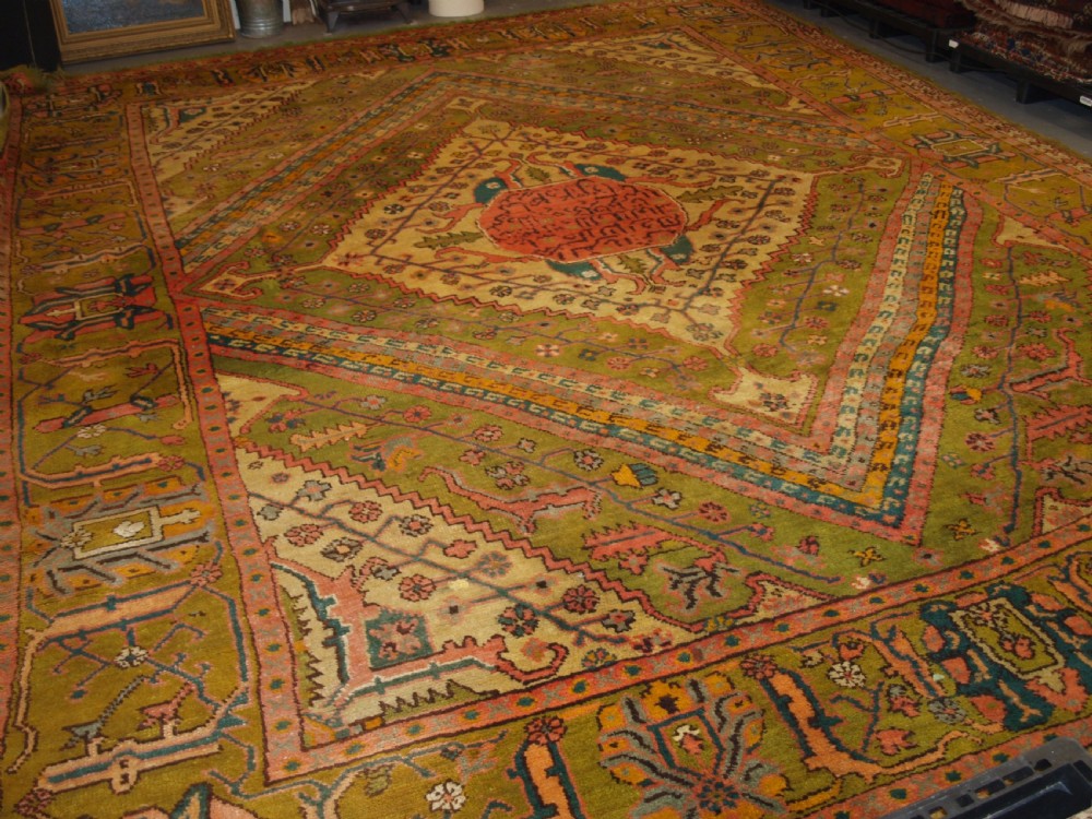 antique turkish oushak carpet unusual green field with classic design late 19th century