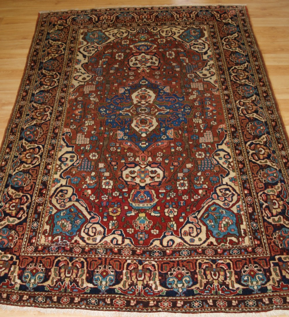 antique isfahan rug with small medallion good colours circa 1900