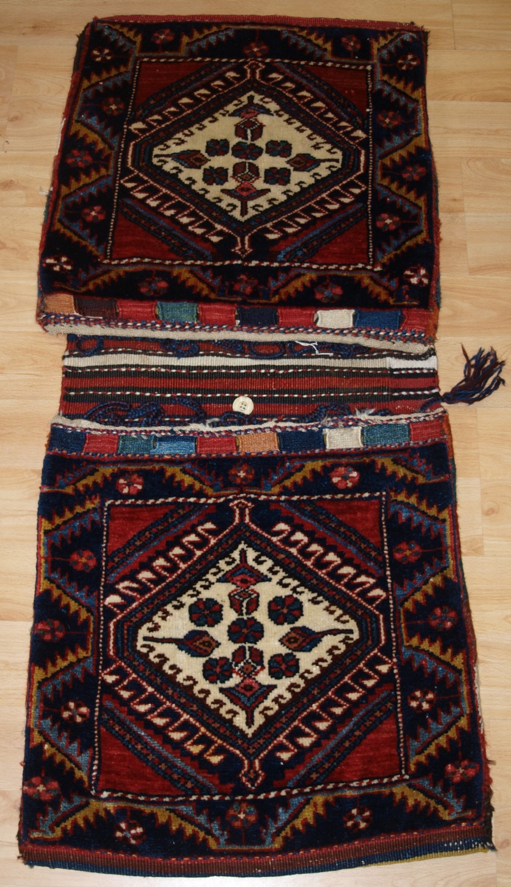 antique complete luri fars region khorjin saddle bags with plain weave back circa 190020