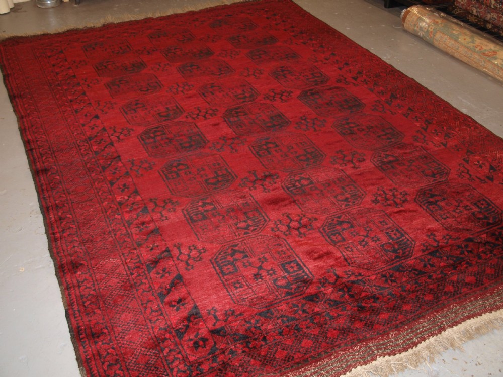old red afghan village carpet slight tension problem hence the low price circa 1920