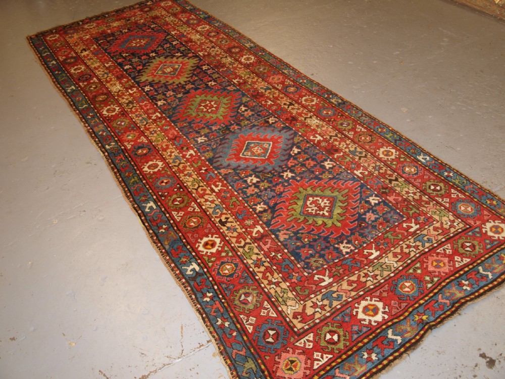 antique caucasian long rug or runner with medallion design superb colours circa 1900