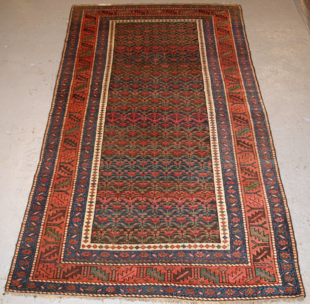antique kurdish long rug with all over shrub design late 19th century