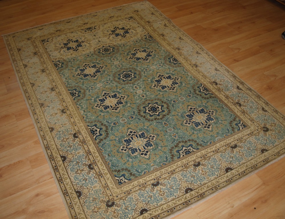 antique kashan rug of fine weave wth soft colours circa 190020