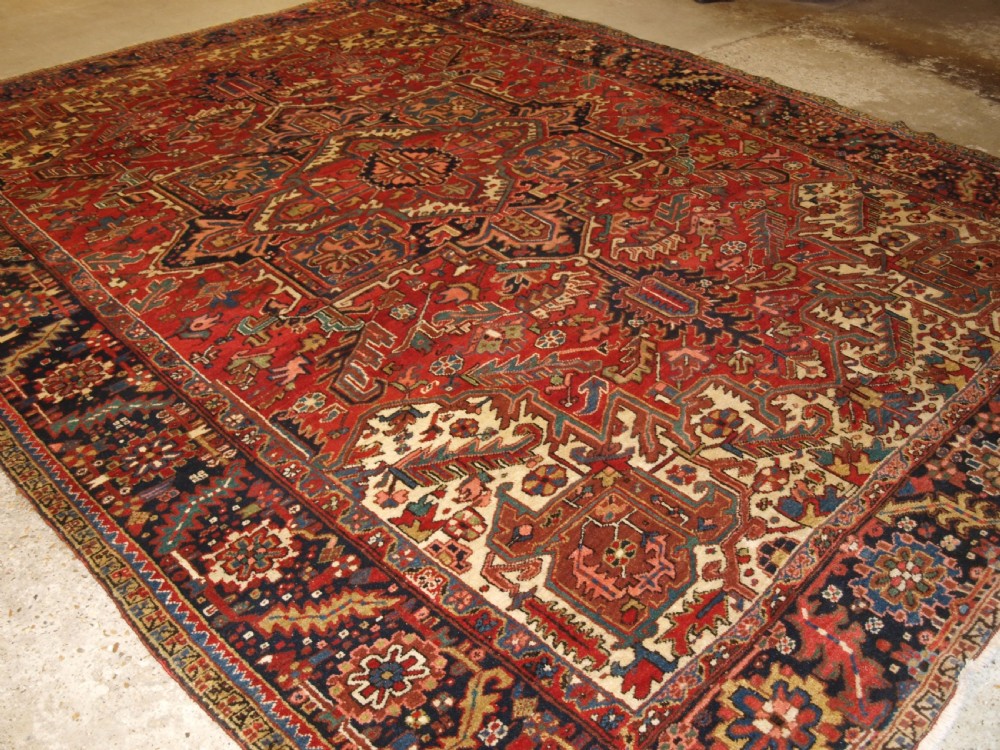 antique heriz carpet large medallion design red ground circa 1920