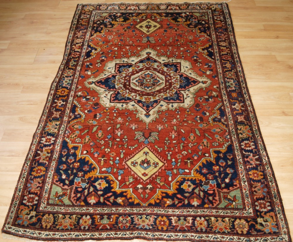 old sarouk rug with traditional design circa 1920