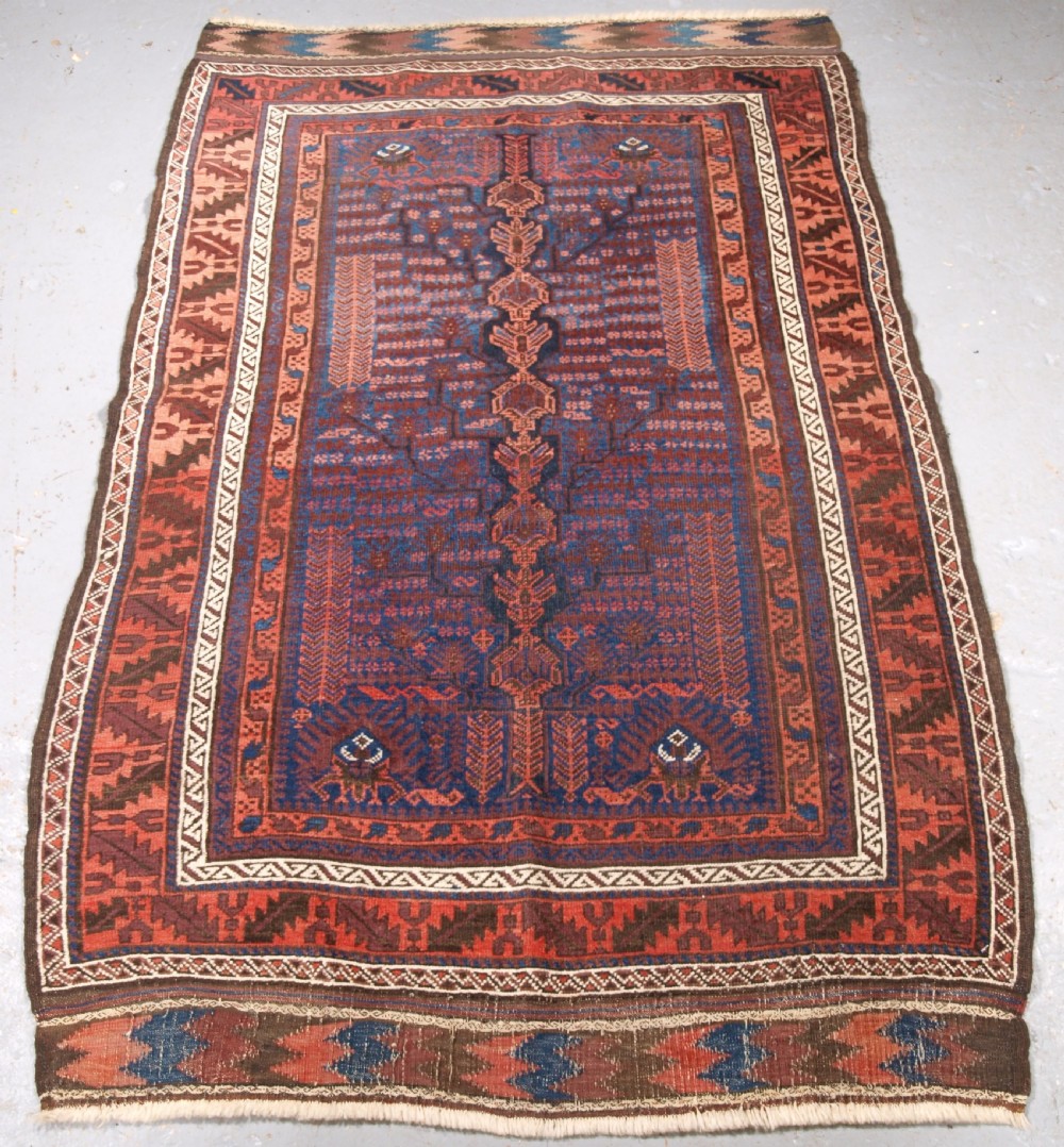 antique timuri baluch rug with blue ground and tree of life circa 1880