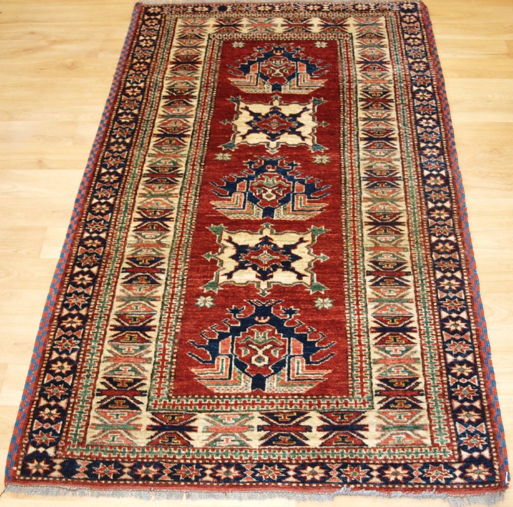 old hand knotted afghan rug of kazak design about 10 years old