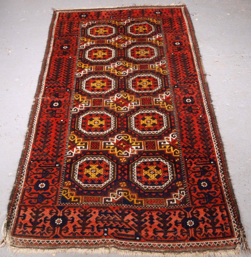 antique salar khani baluch rug with turreted guls circa 1900
