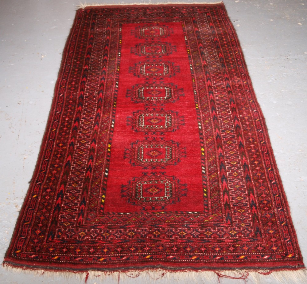 old afghan village long rug with turkmen turreted guls circa 1920