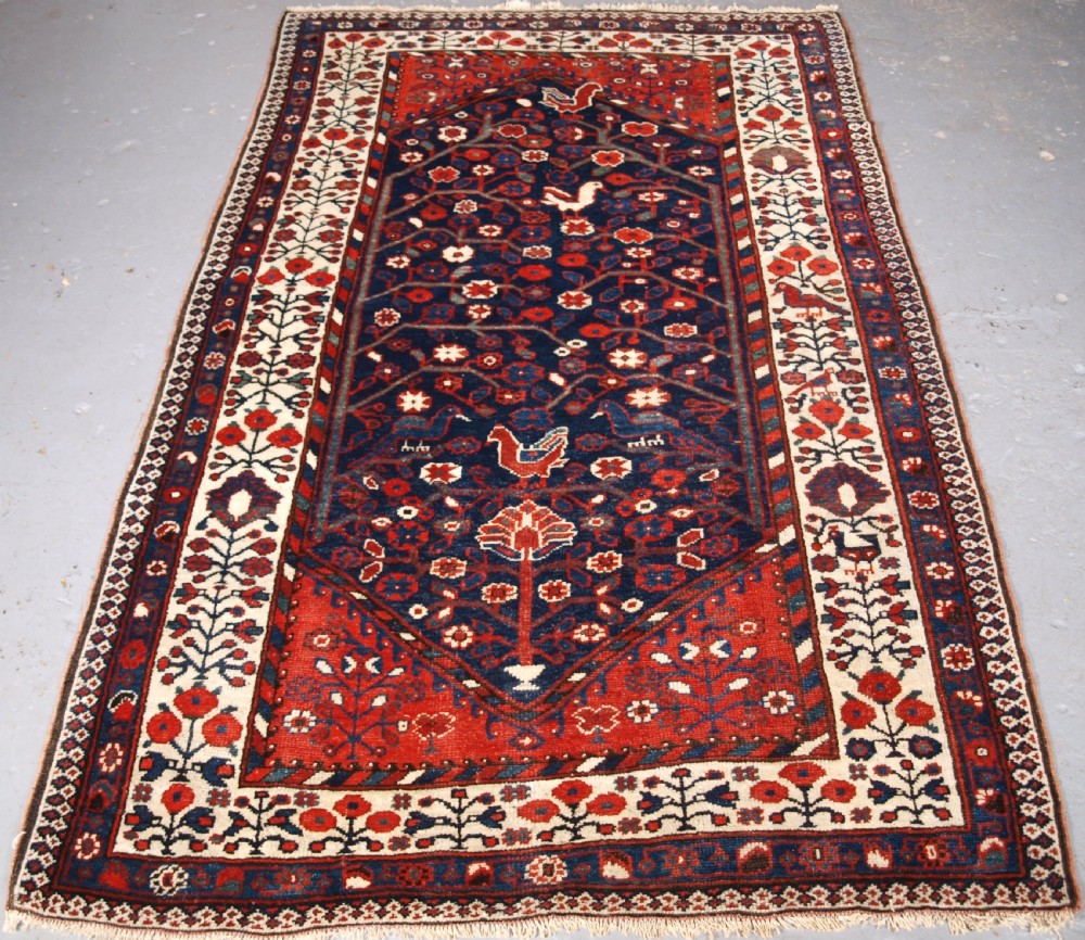 antique luri rug of outstanding design flowers and birds circa 1900