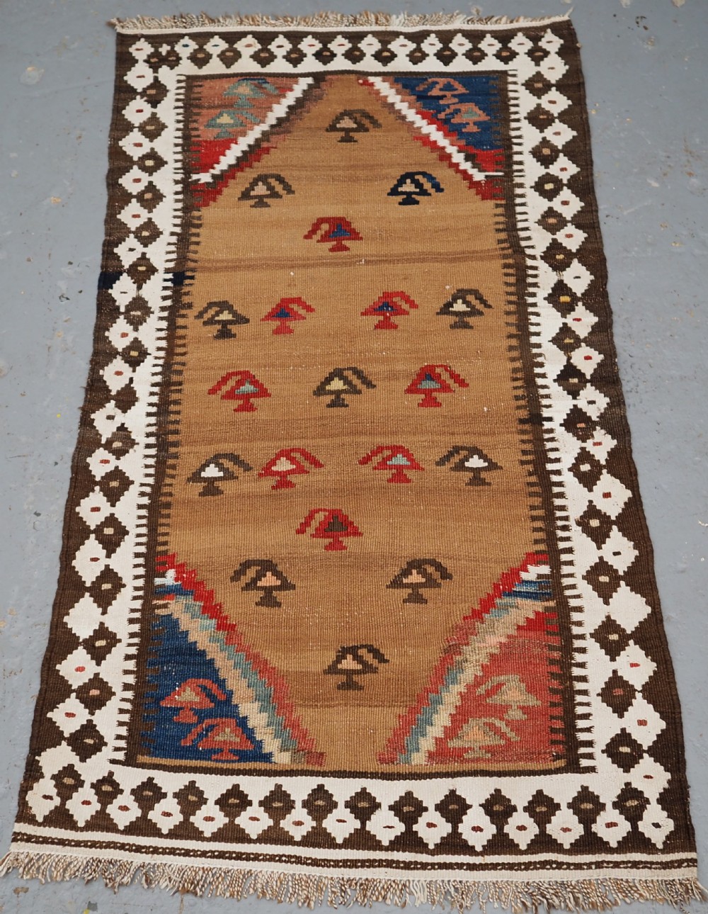 antique small tribal kilim by the luri or bakhtiari camel wool and cotton circa 1900