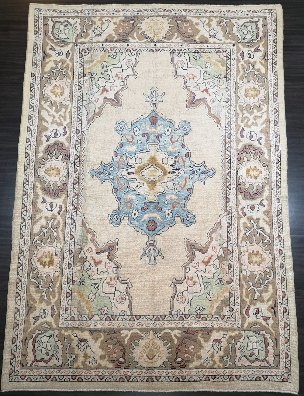 turkish oushak village carpet hand knotted in soft colours traditional small medallion design