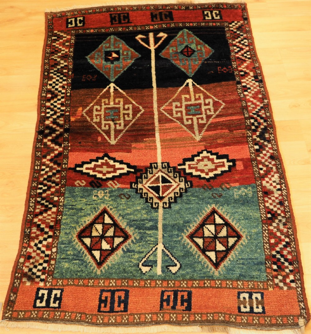 antique turkish yuruk rug of smll size and charming design circa 1900