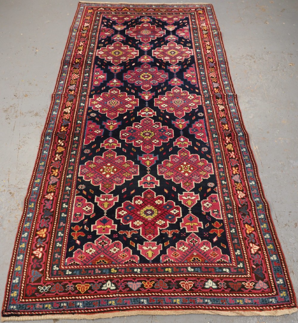 antique caucasian lampakarabagh long rug with striking colour circa 1900