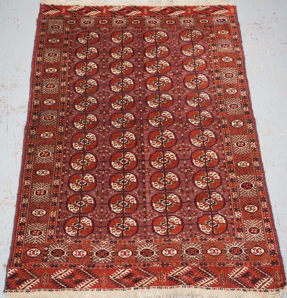 antique tekke turkmen 'dip khali' rug with aubergine field colour circa 1900