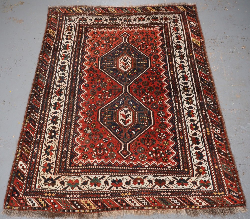 antique shiraz rug with linked medallion design circa 1920