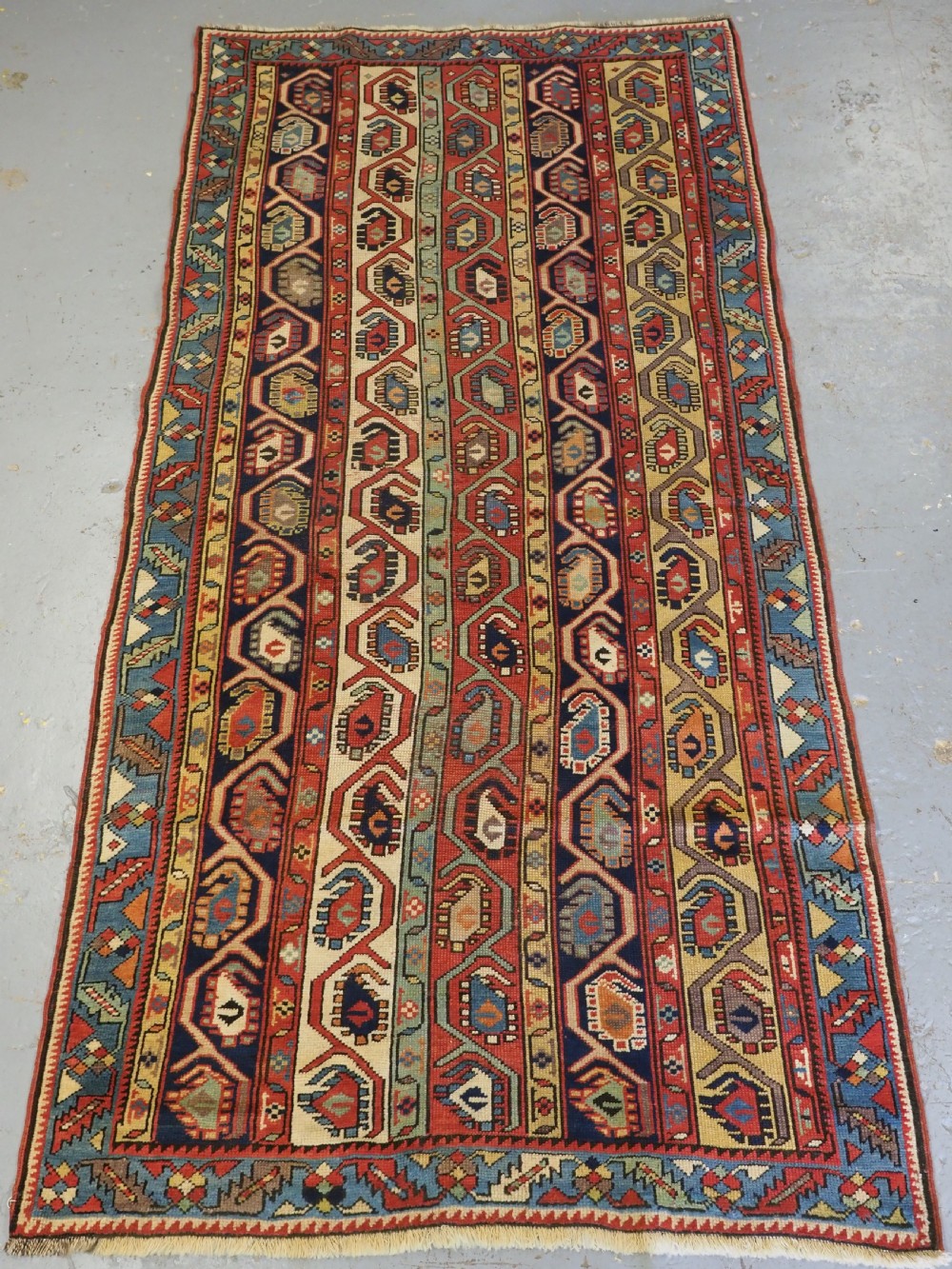 antique caucasian gendje kazak long rug with boteh design circa 1880