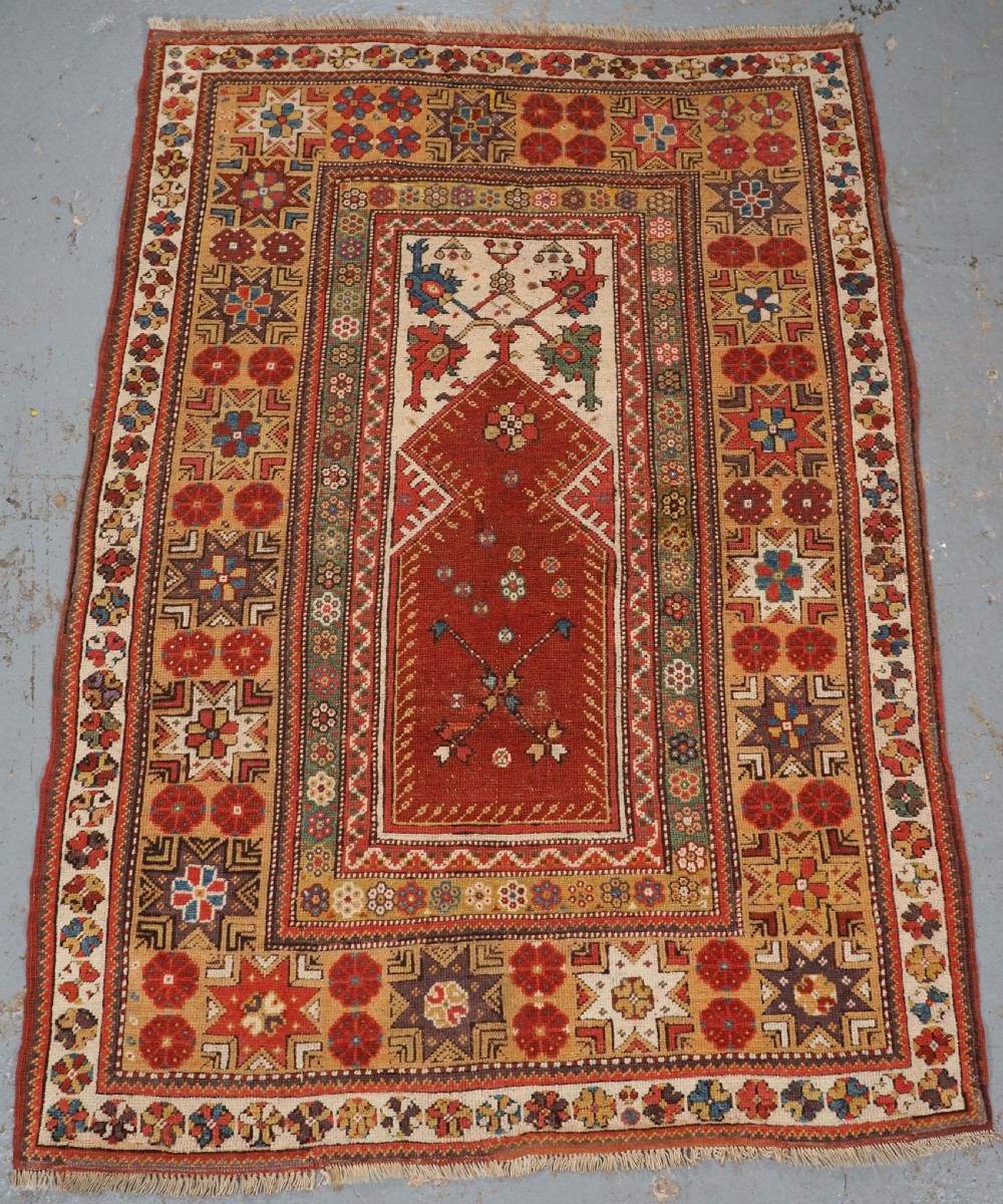 antique turkish milas prayer rug star rosette border circa 18001825